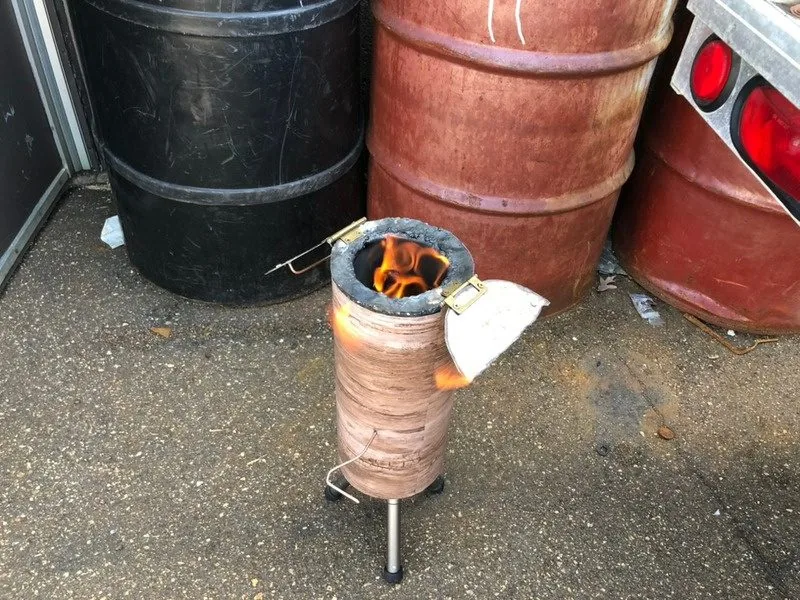The 2019 prototype burning, a log-form fire pit with a mechanical lid